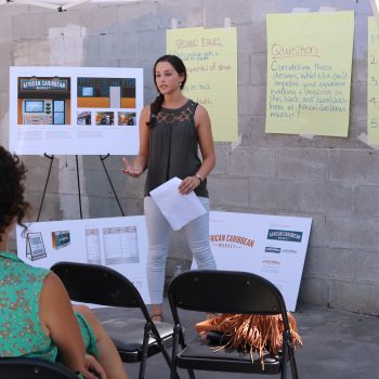 Leah facilitating a community design meeting at African Caribbean Market. 